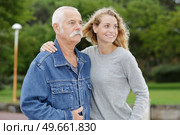 adult woman with her arm around senior father. Стоковое фото, агентство Ingram Publishing / Фотобанк Лори
