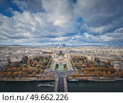 Aerial panoramic view from the Eiffel tower height to the Paris cityscape, France. Seine river, Trocadero area and La Defense metropolitan district seen on the horizon. Стоковое фото, агентство Ingram Publishing / Фотобанк Лори