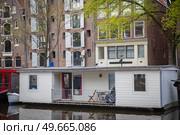 Ancient streets and canals in the city center of Amsterdam. Netherlands. Стоковое фото, агентство Ingram Publishing / Фотобанк Лори