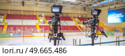 video cameras for live broadcast of sports competition in the ice arena. Стоковое фото, агентство Ingram Publishing / Фотобанк Лори