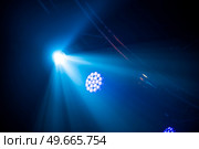 rays of light illuminate the scene at the concert. Стоковое фото, агентство Ingram Publishing / Фотобанк Лори
