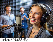 Woman Wearing Headphones in Front of Microphone. Generative AI. Стоковое AI-изображение, AI-художник Roman Zavorotny / Фотобанк Лори