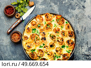 Vegetables frittata baked with cheese in pita bread. Frittata or casserole on a concrete table. Vegetable casserole in pita bread, vegetarian recipe. Стоковое фото, агентство Ingram Publishing / Фотобанк Лори