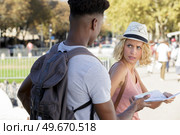 mixed couple of tourists arguing about directions. Стоковое фото, агентство Ingram Publishing / Фотобанк Лори