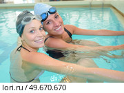 portrait of women swimmers smiling. Стоковое фото, агентство Ingram Publishing / Фотобанк Лори