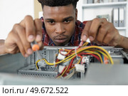 a worker is checking the terminals. Стоковое фото, агентство Ingram Publishing / Фотобанк Лори