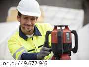 geometer at work construction foundation site. Стоковое фото, агентство Ingram Publishing / Фотобанк Лори