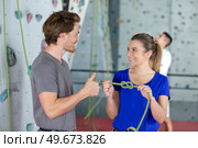 man and woman exercising at indoor climbing gym. Стоковое фото, агентство Ingram Publishing / Фотобанк Лори