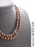 author beautiful  pearls necklaces demonstrated on maneken. fashion and jewelry concept. Стоковое фото, агентство Ingram Publishing / Фотобанк Лори