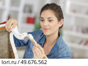 woman painting renewing chair at home. Стоковое фото, агентство Ingram Publishing / Фотобанк Лори