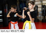 Preparatory stage of training, teen children are doing strength exercises in gym. Стоковое фото, фотограф Яков Филимонов / Фотобанк Лори