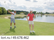 portrait of couple in the golf course. Стоковое фото, агентство Ingram Publishing / Фотобанк Лори