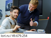 technicians stand in industry environment. Стоковое фото, агентство Ingram Publishing / Фотобанк Лори
