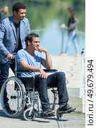 man in a wheelchair looking at the sea. Стоковое фото, агентство Ingram Publishing / Фотобанк Лори