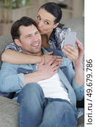 man and woman doing selfie at home. Стоковое фото, агентство Ingram Publishing / Фотобанк Лори
