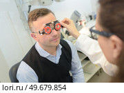 man having check-up at the ophthalmologist. Стоковое фото, агентство Ingram Publishing / Фотобанк Лори