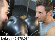 Boxers with gloves touching. Стоковое фото, агентство Ingram Publishing / Фотобанк Лори