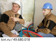 electric floor heating system installation in new house. Стоковое фото, агентство Ingram Publishing / Фотобанк Лори