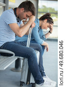 disappointed couple waiting at bus stop. Стоковое фото, агентство Ingram Publishing / Фотобанк Лори
