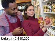 meticulous customer reading the label. Стоковое фото, агентство Ingram Publishing / Фотобанк Лори