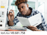 man repairing color printer changing toner. Стоковое фото, агентство Ingram Publishing / Фотобанк Лори