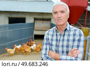 Portrait of farmer with chickens. Стоковое фото, агентство Ingram Publishing / Фотобанк Лори