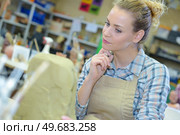 a female artist during contemplation. Стоковое фото, агентство Ingram Publishing / Фотобанк Лори