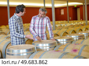 two men in the cooperage. Стоковое фото, агентство Ingram Publishing / Фотобанк Лори