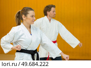 man and woman are beating punch arm. Стоковое фото, агентство Ingram Publishing / Фотобанк Лори