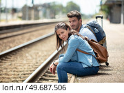 depressed travelers waiting at train station after mistakes a train. Стоковое фото, агентство Ingram Publishing / Фотобанк Лори