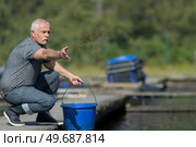 portrait of man and catfish. Стоковое фото, агентство Ingram Publishing / Фотобанк Лори