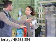 factory workers in the process of working on the equipment. Стоковое фото, агентство Ingram Publishing / Фотобанк Лори
