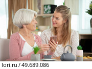 happy loving older mature mother and grown millennial daughter. Стоковое фото, агентство Ingram Publishing / Фотобанк Лори