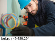 electrician engineer tests electrical installations. Стоковое фото, агентство Ingram Publishing / Фотобанк Лори
