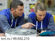 crew repairing machine in hangar. Стоковое фото, агентство Ingram Publishing / Фотобанк Лори