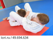 men are doing a grappling competition. Стоковое фото, агентство Ingram Publishing / Фотобанк Лори