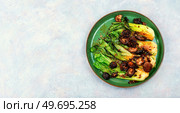 Chinese fried Pak Choi with shitake mushrooms. Asian vegan food. Space for text. Fried Chinese cabbage pak choi. Стоковое фото, агентство Ingram Publishing / Фотобанк Лори