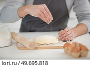 close up of male hands kneading dough. Стоковое фото, агентство Ingram Publishing / Фотобанк Лори