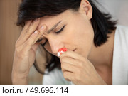 young woman with bleeding nose. Стоковое фото, агентство Ingram Publishing / Фотобанк Лори