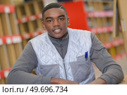 portrait of young male warehouse worker. Стоковое фото, агентство Ingram Publishing / Фотобанк Лори