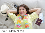 young female traveler lying on the hotel bed. Стоковое фото, агентство Ingram Publishing / Фотобанк Лори