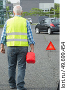 senior aged man holding gas can to refill his car. Стоковое фото, агентство Ingram Publishing / Фотобанк Лори