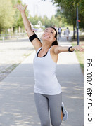 happy runner has finished her course. Стоковое фото, агентство Ingram Publishing / Фотобанк Лори