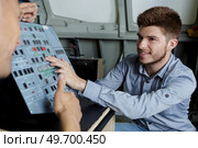 young man in flight simulator for the training pilots. Стоковое фото, агентство Ingram Publishing / Фотобанк Лори