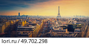 Sightseeing Paris panorama with view to the Eiffel Tower, France. Beautiful parisian cityscape sunset scene. Romantic view over rooftops of historic buildings and landmarks. Holiday destination. Стоковое фото, агентство Ingram Publishing / Фотобанк Лори