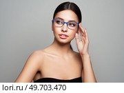 Woman with long eyelashes in eyeglasses. Vision correction. Poor eyesight. Spectacle frame. Makeup, cosmetics, beauty. Close up, macro. Стоковое фото, агентство Ingram Publishing / Фотобанк Лори