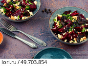 Diet salad of beets, nuts and cheese on the plate.. Beetroot salad with wallnuts and cheese. Стоковое фото, агентство Ingram Publishing / Фотобанк Лори