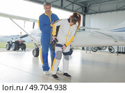 preparation of parachutes for sky divers in hangar. Стоковое фото, агентство Ingram Publishing / Фотобанк Лори