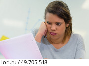 pretty female student larning unpleasant news about her exam results. Стоковое фото, агентство Ingram Publishing / Фотобанк Лори