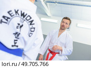 man training in a taekwondo class. Стоковое фото, агентство Ingram Publishing / Фотобанк Лори